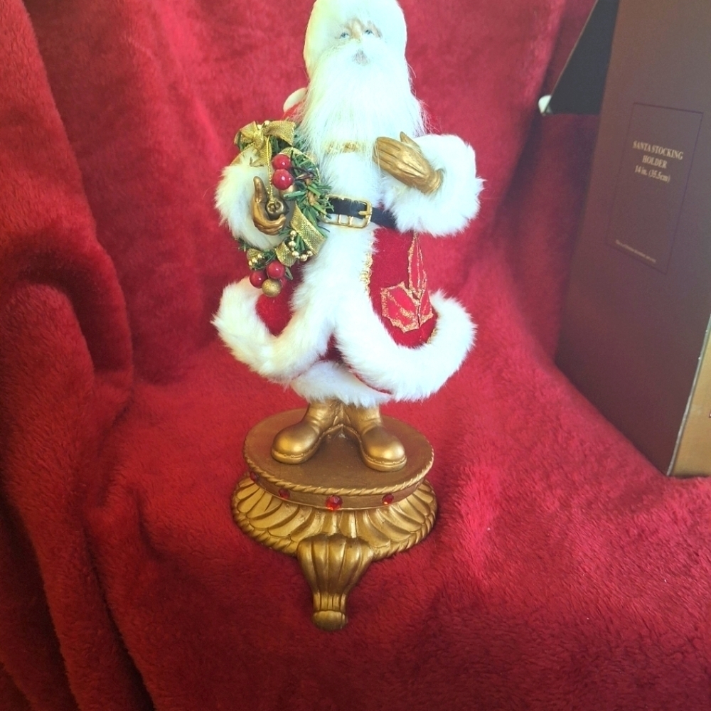 SANTA CLAUSE STOCKING HOLDER .by Each separately